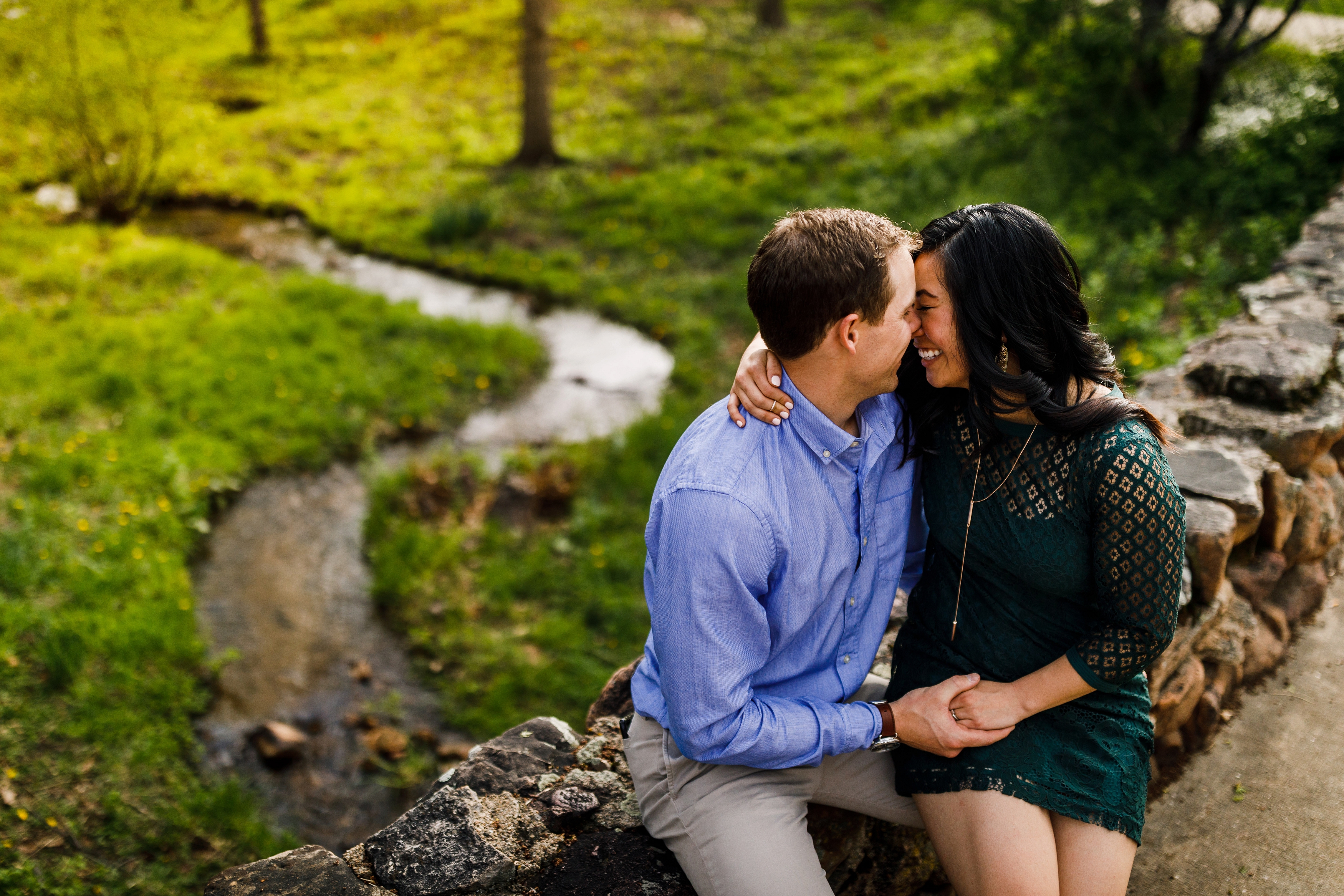 Engagement photo of couple on a bridge at CU Campus in Boulder, CO