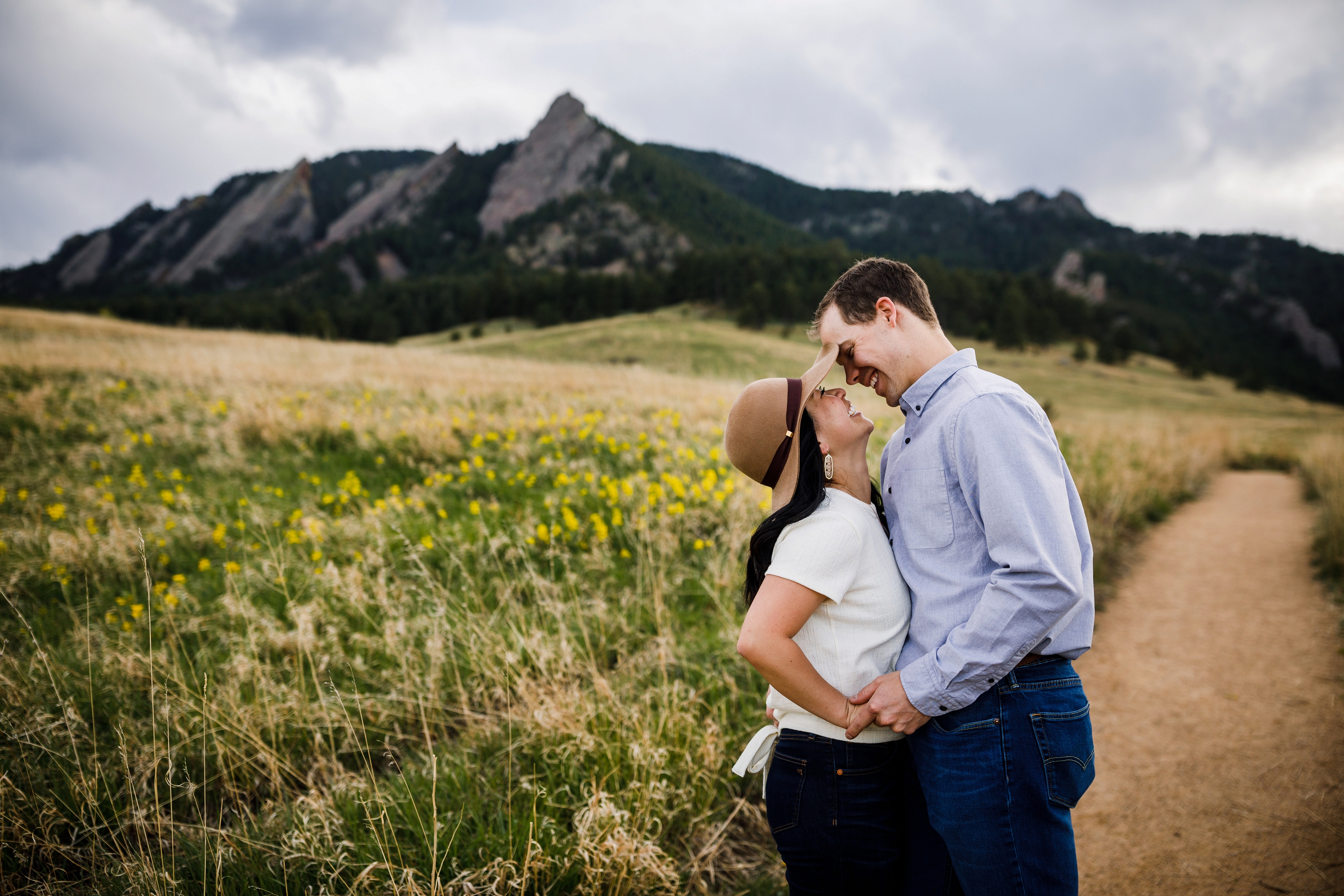 Flatiron Engagement photo with field of wildflowers