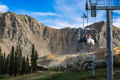 Couple rides chairlift at A Basin, CO
