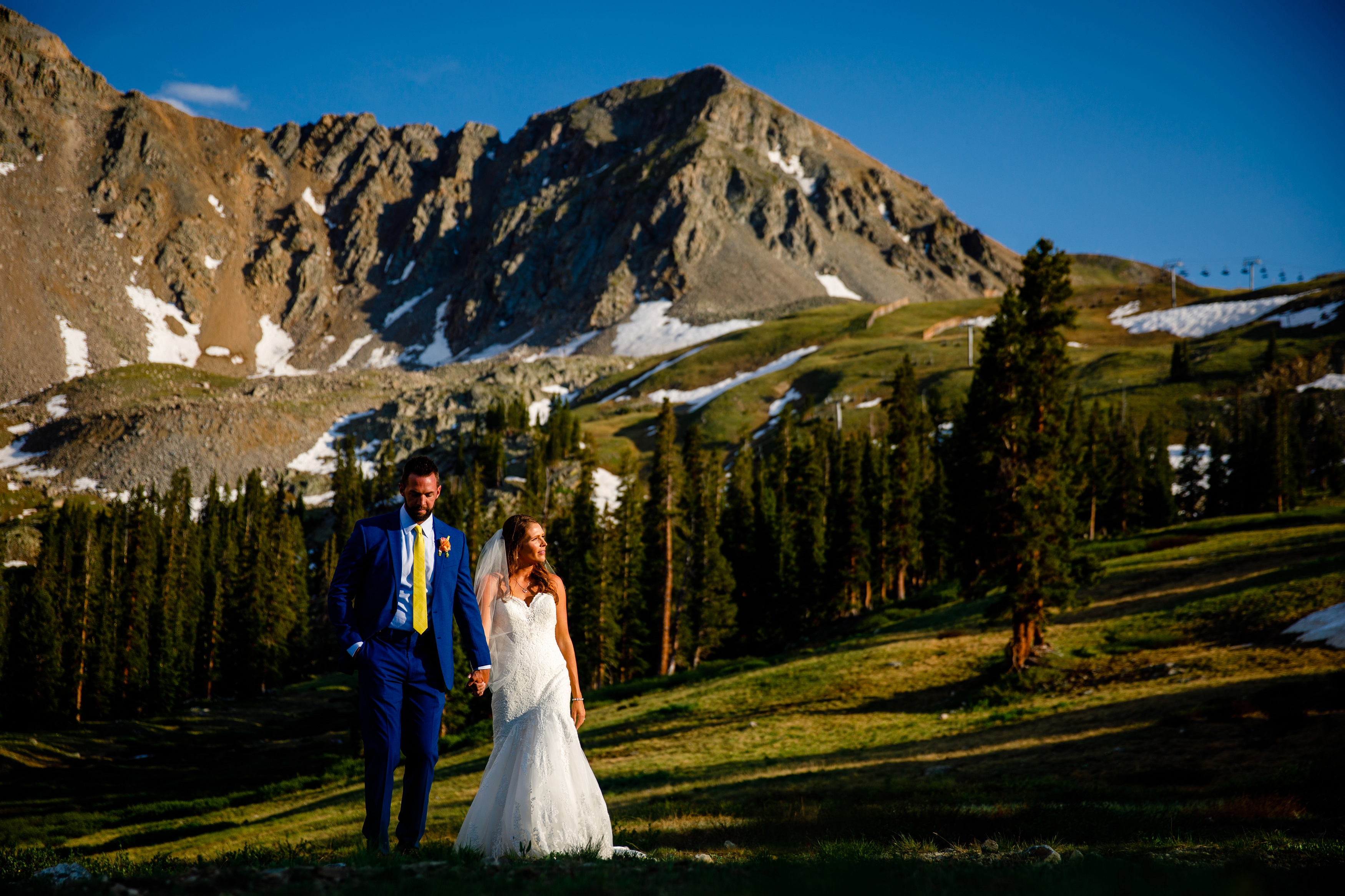 Arapahoe Basin Summer Wedding Photo of bride & groom walking