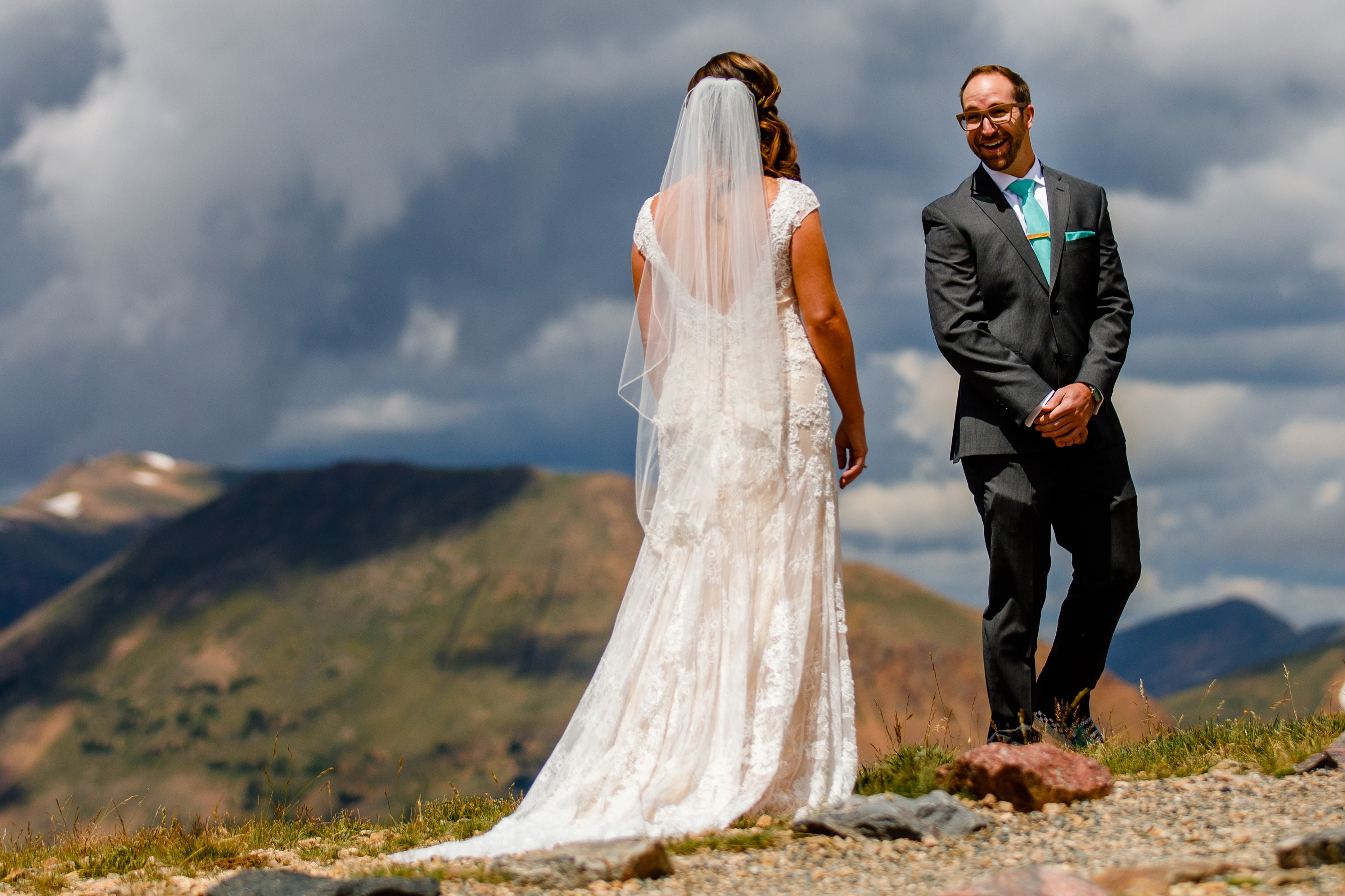 Bride & groom's first look on top of Loveland Pass before their Black Mountain Lodge Wedding