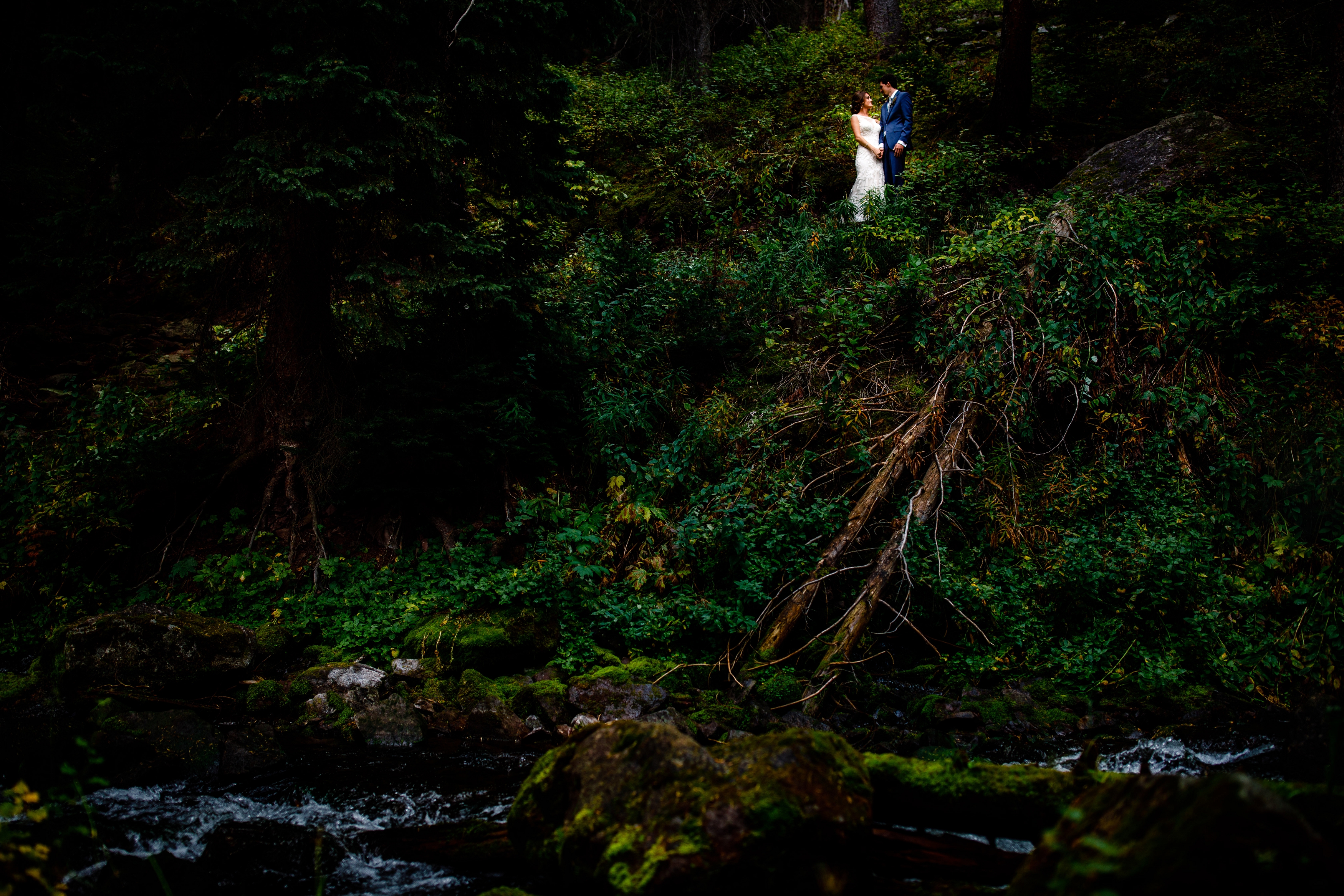 A bride & groom see each other for the first time next to Maroon Creek.