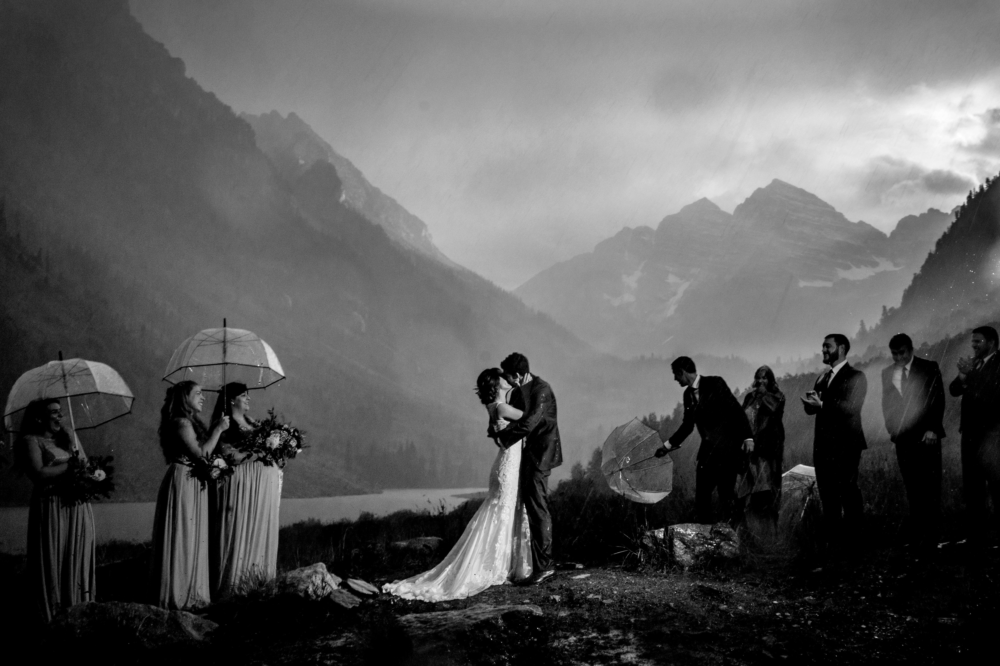 A groom & bride exchanged their first kiss among friends & family at the Maroon Bells Amphitheater. 