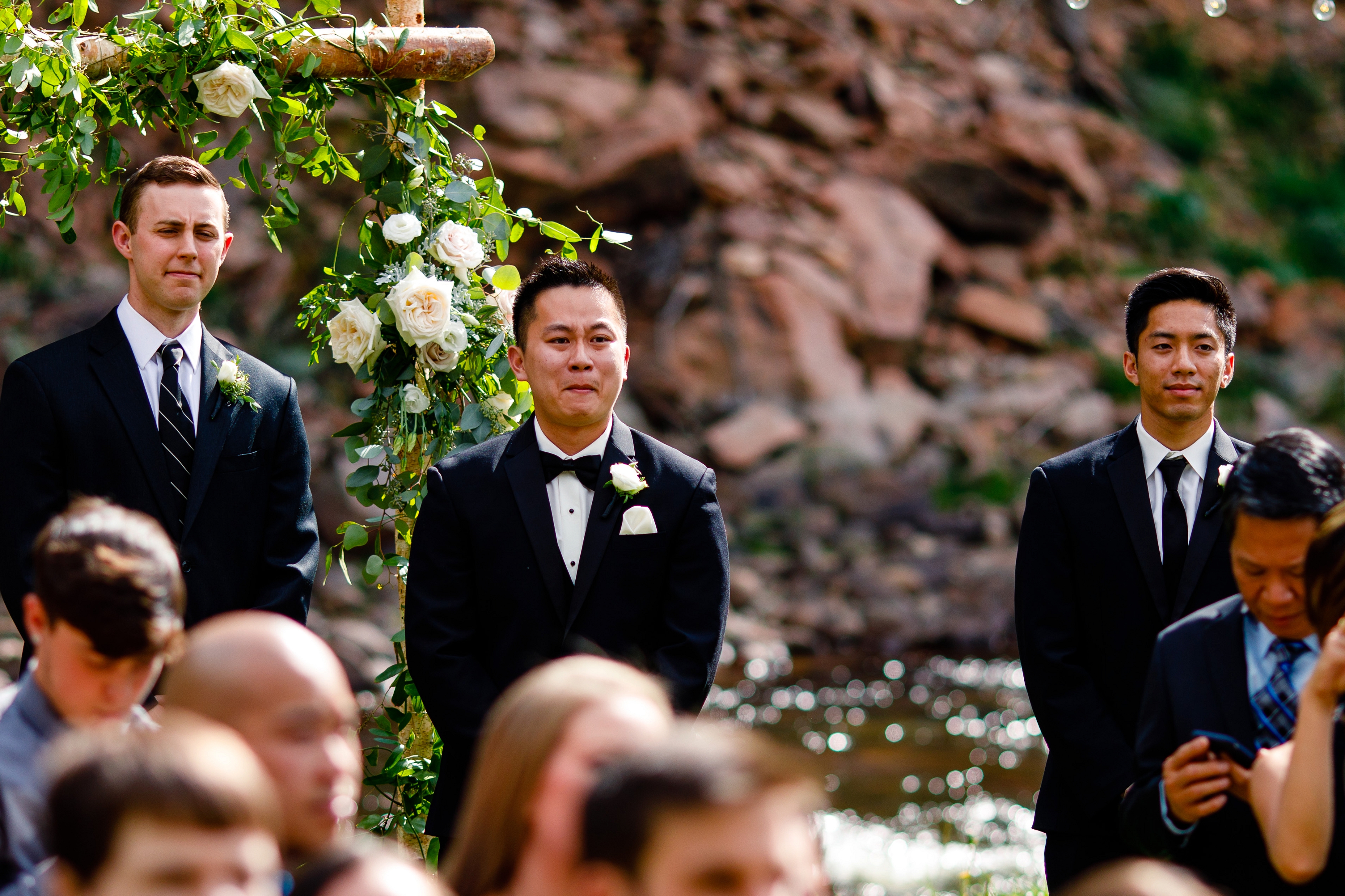 Groom reacting to the bride coming down the isle for this River Bend Wedding