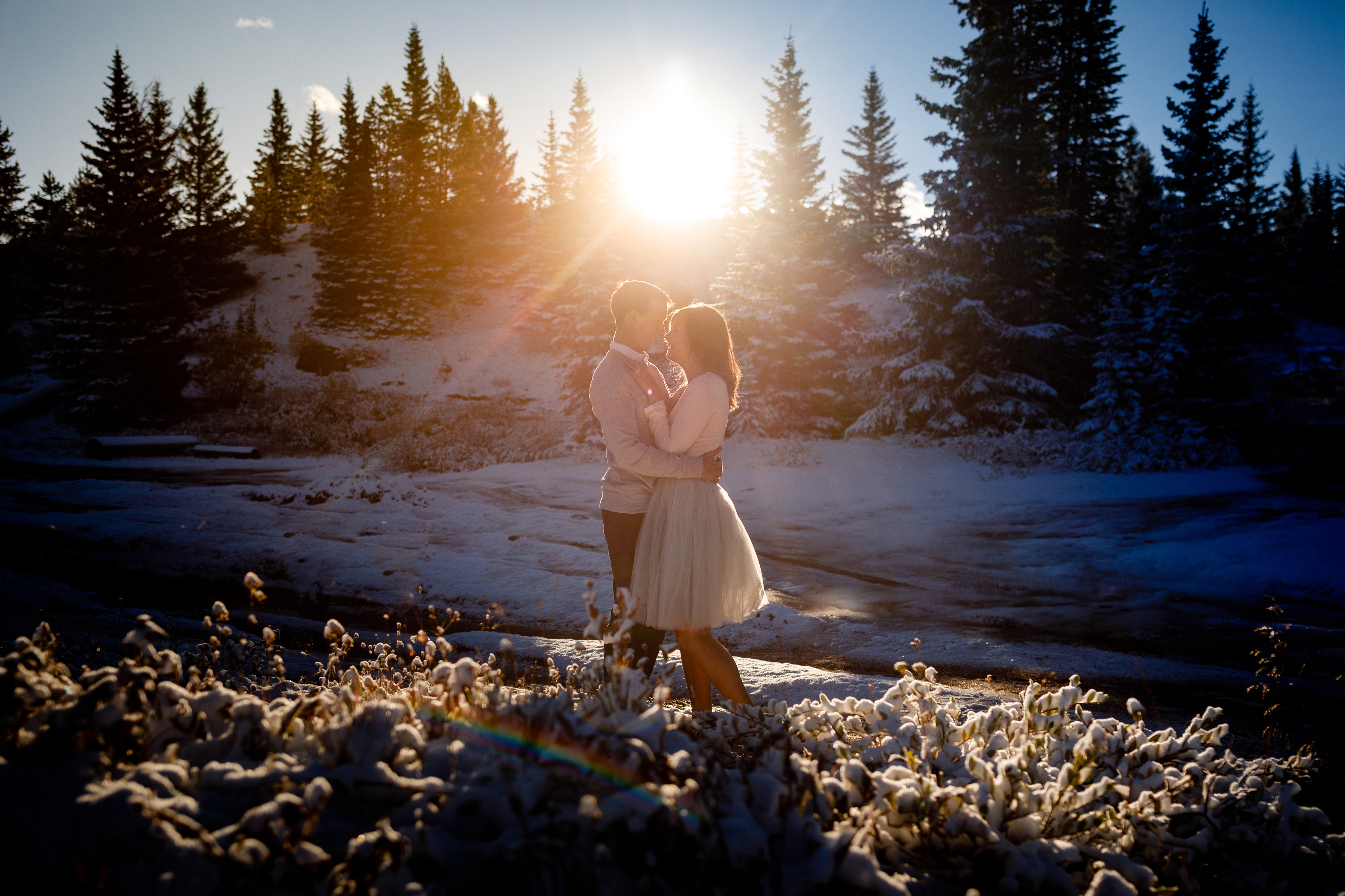 Vail Pass Engagement photos during winter with some snow on the ground.