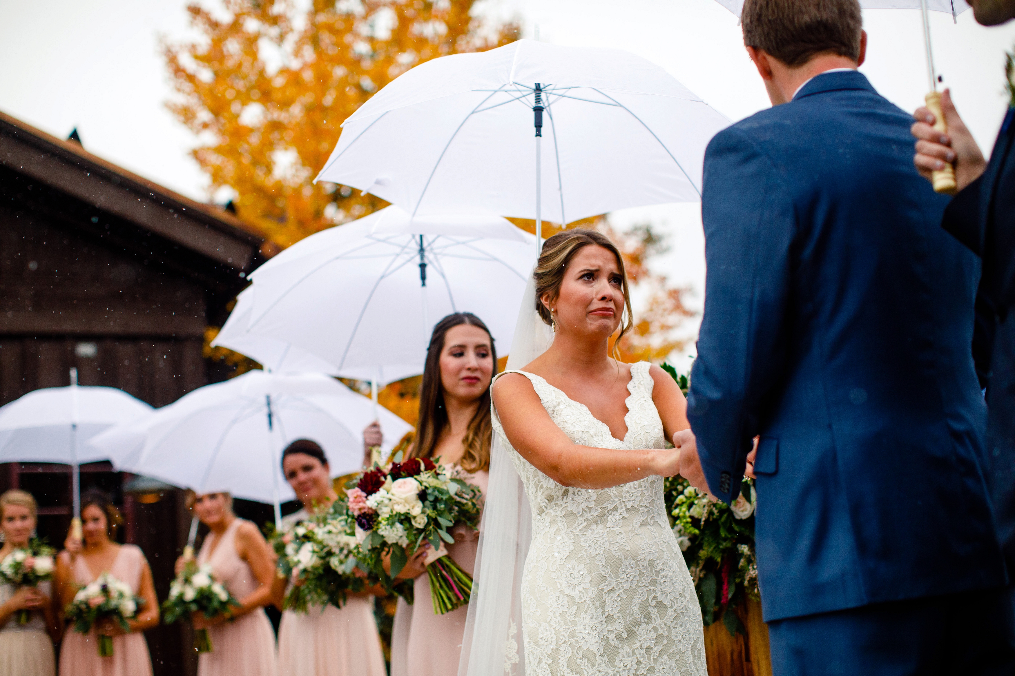 A bride cries during her ceremony at Tenmile Station in Breckenridge, CO.