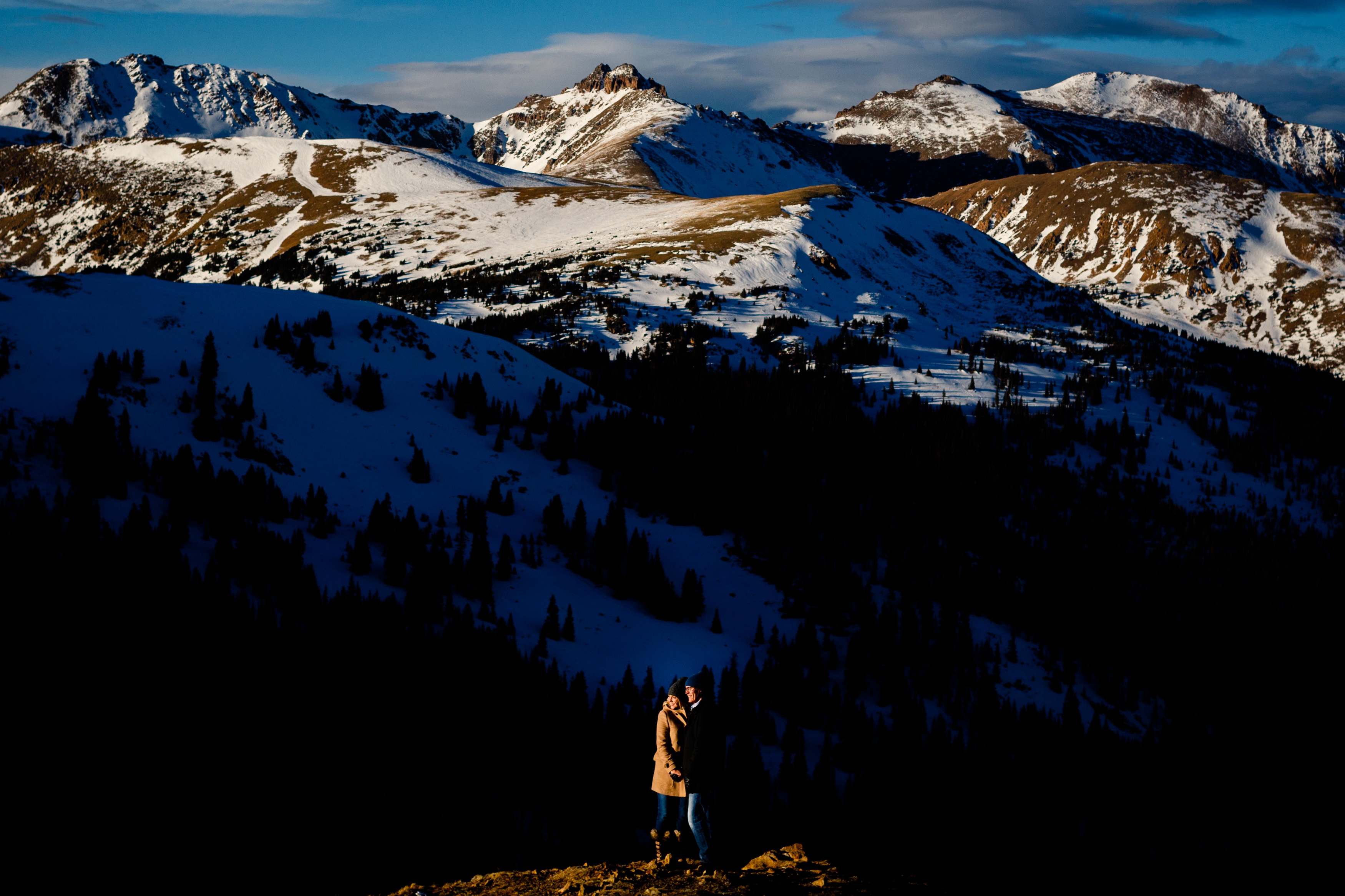 A beautifully sunlit engagement photo on top of Loveland Pass near Keystone, CO.