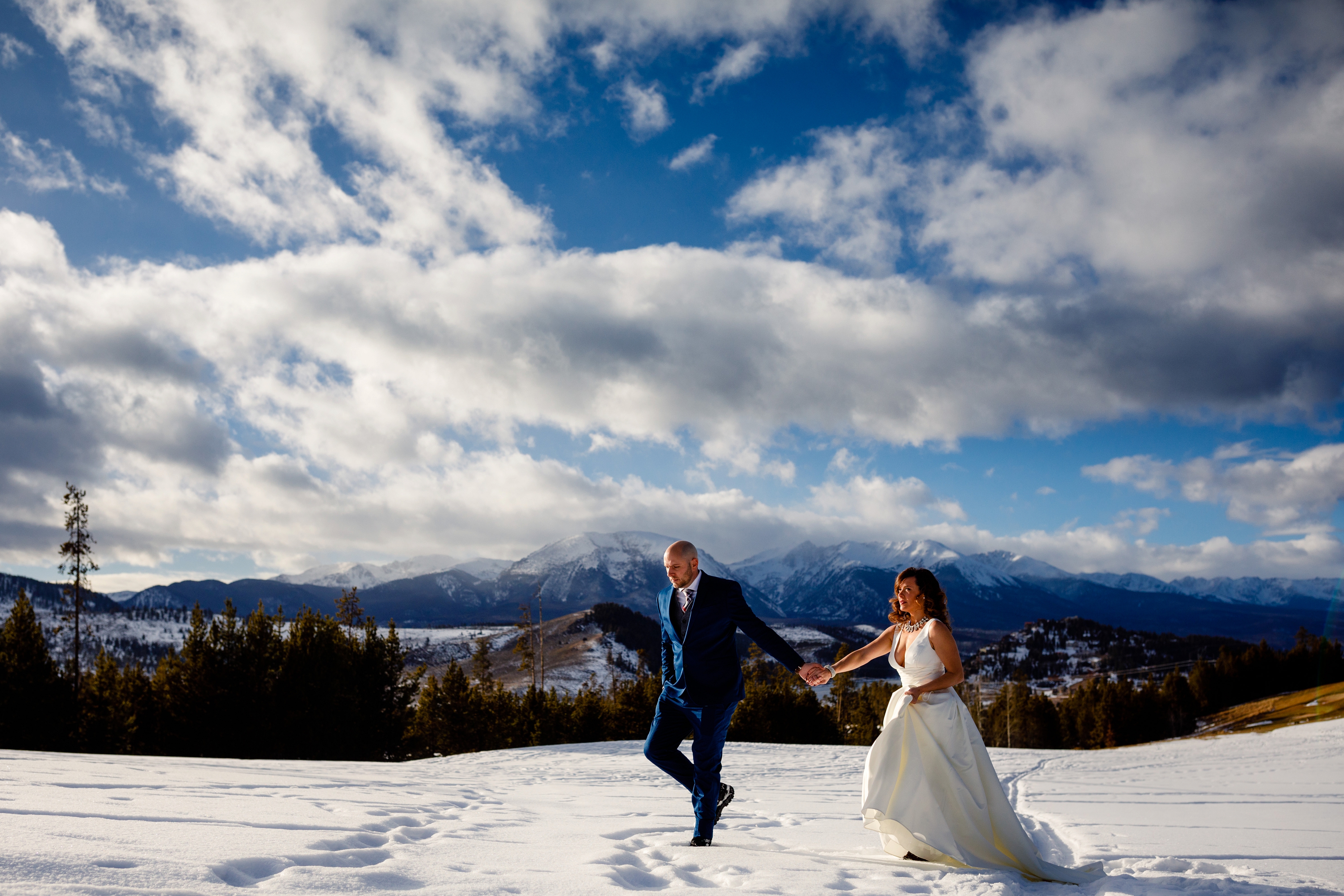 The bride and groom take their first walk together right before their Keystone Ranch Winter Wedding.