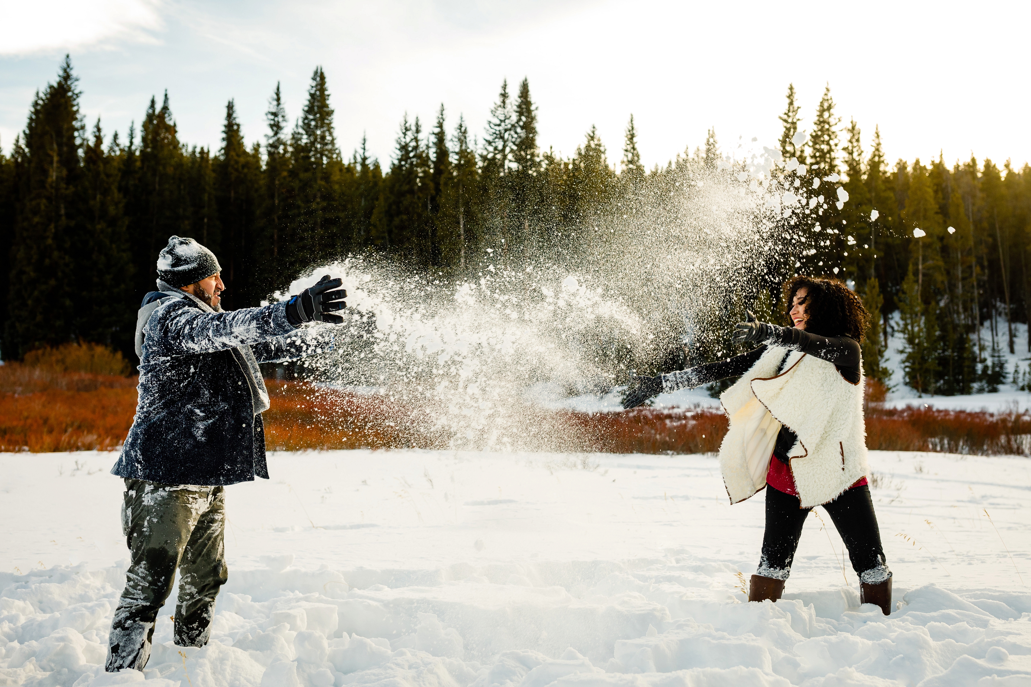 A snowball fight during engagement photos near Boreas Pass.