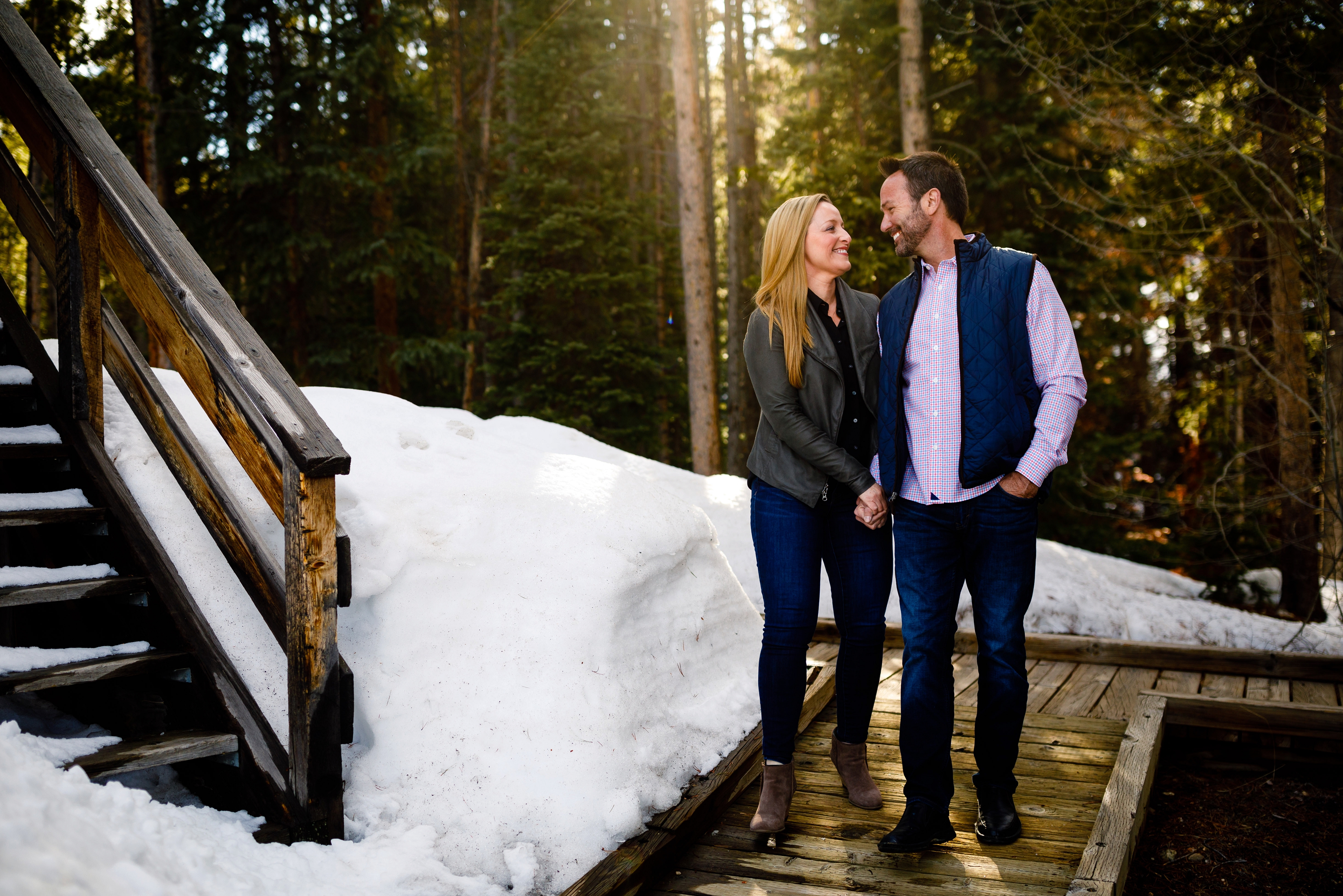 TJ & Donna walk hand-in-hand through the snowdrifts for their Breckenridge Spring Engagement.