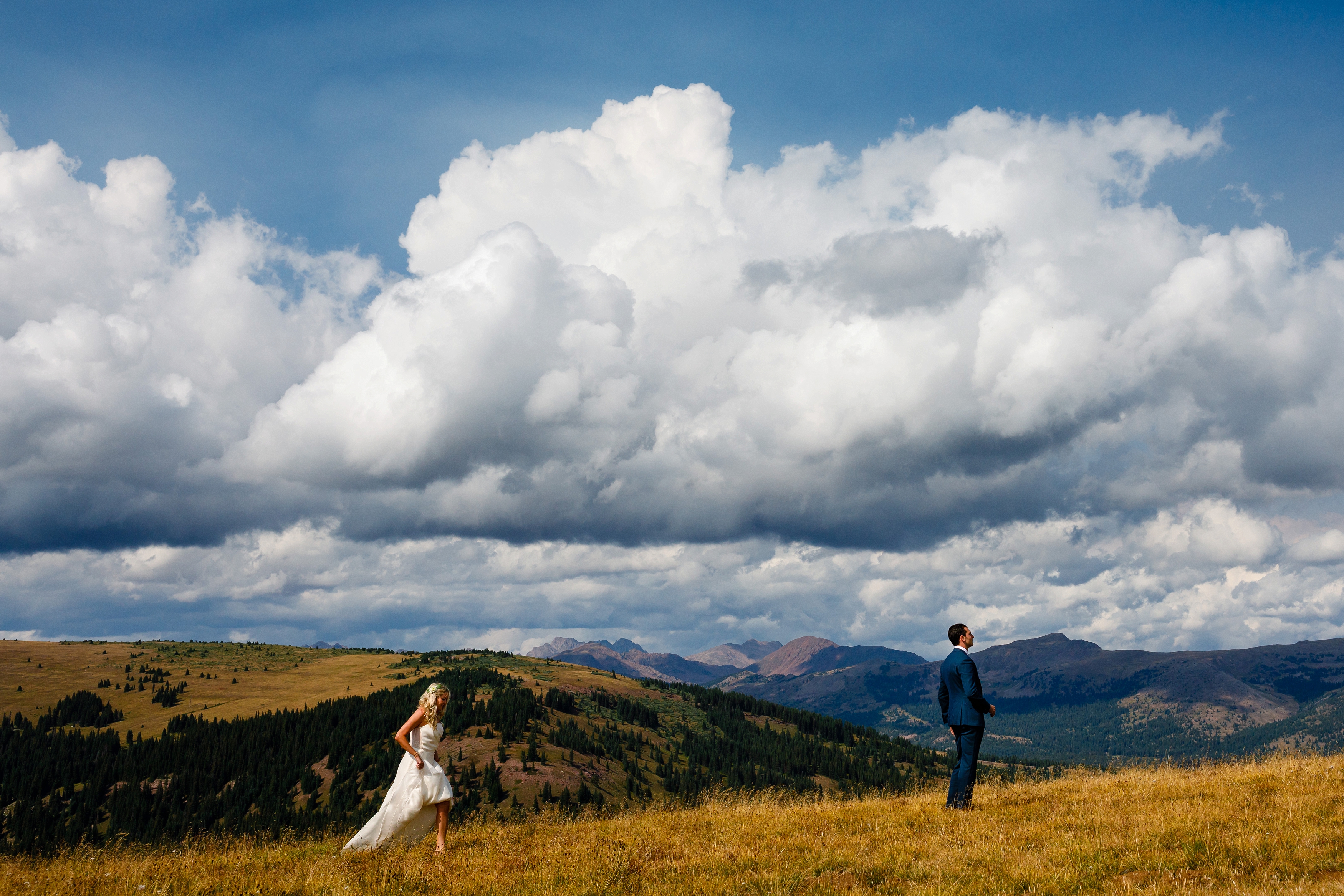 The groom's first look at his beautiful bride on top of Ptarmigan Pass.