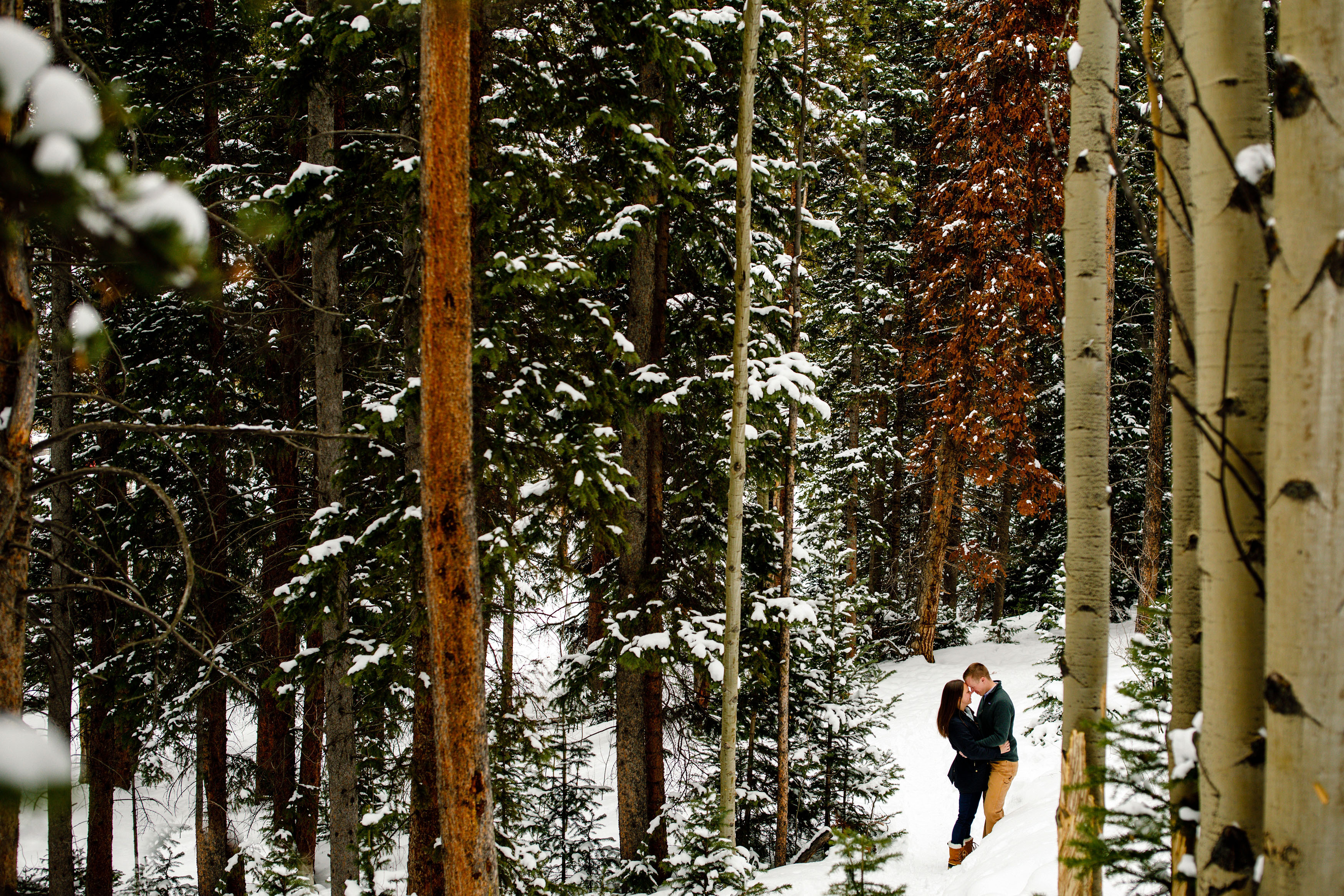 A winter engagement photo near the Ice Arena in Breckenridge, CO.