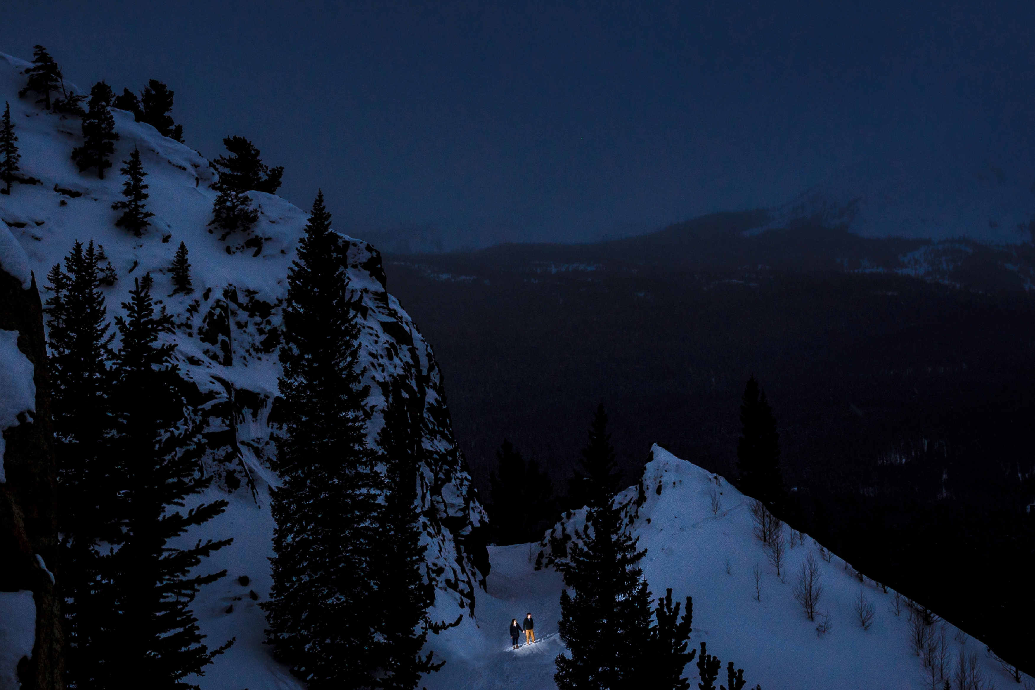 Walking on Boreas Pass during their winter engagement photo shoot just outside of Breckenridge.