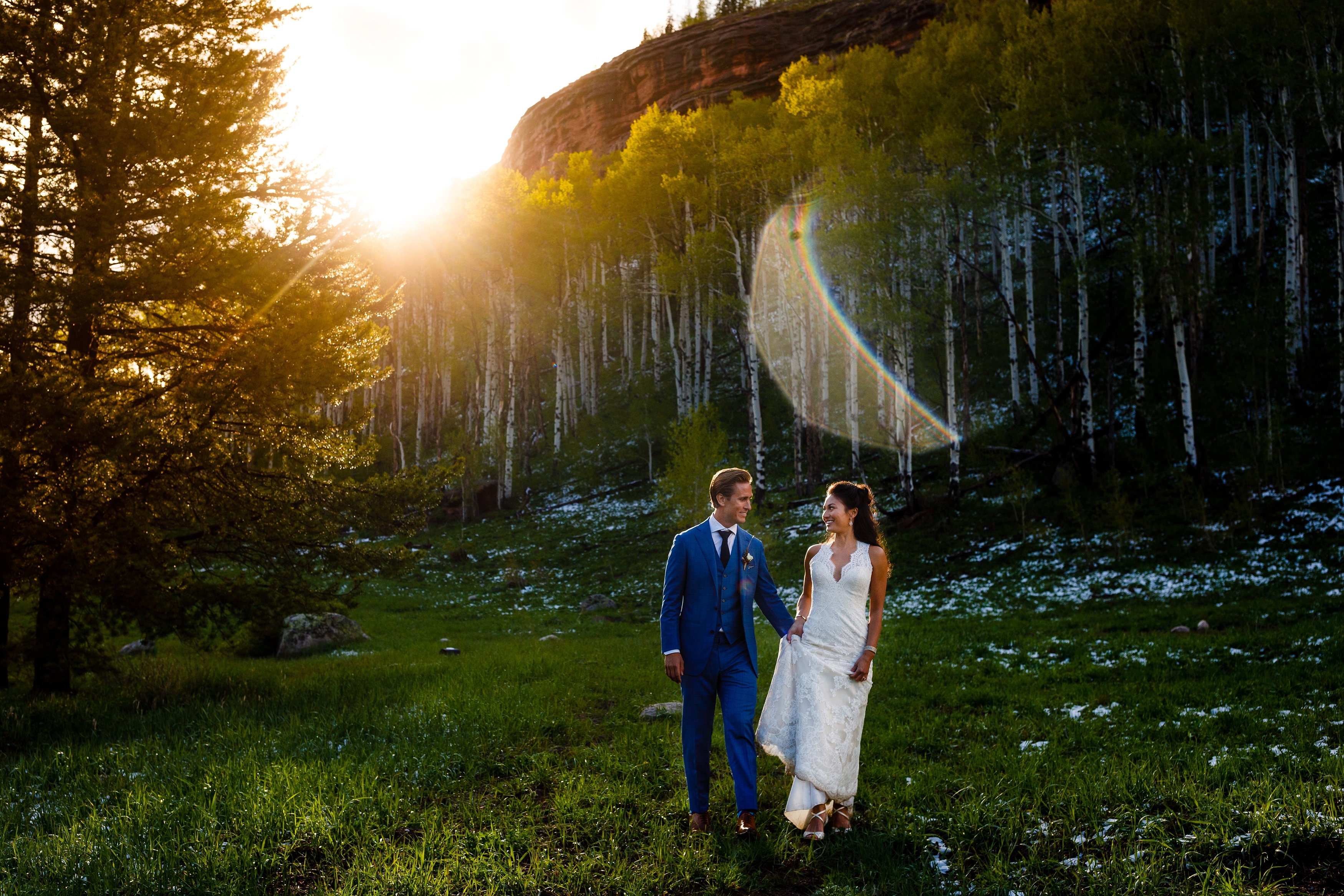 These two newlyweds take a stroll for the last bits of sunlight during their June wedding at Piney River Ranch just outside of Vail.