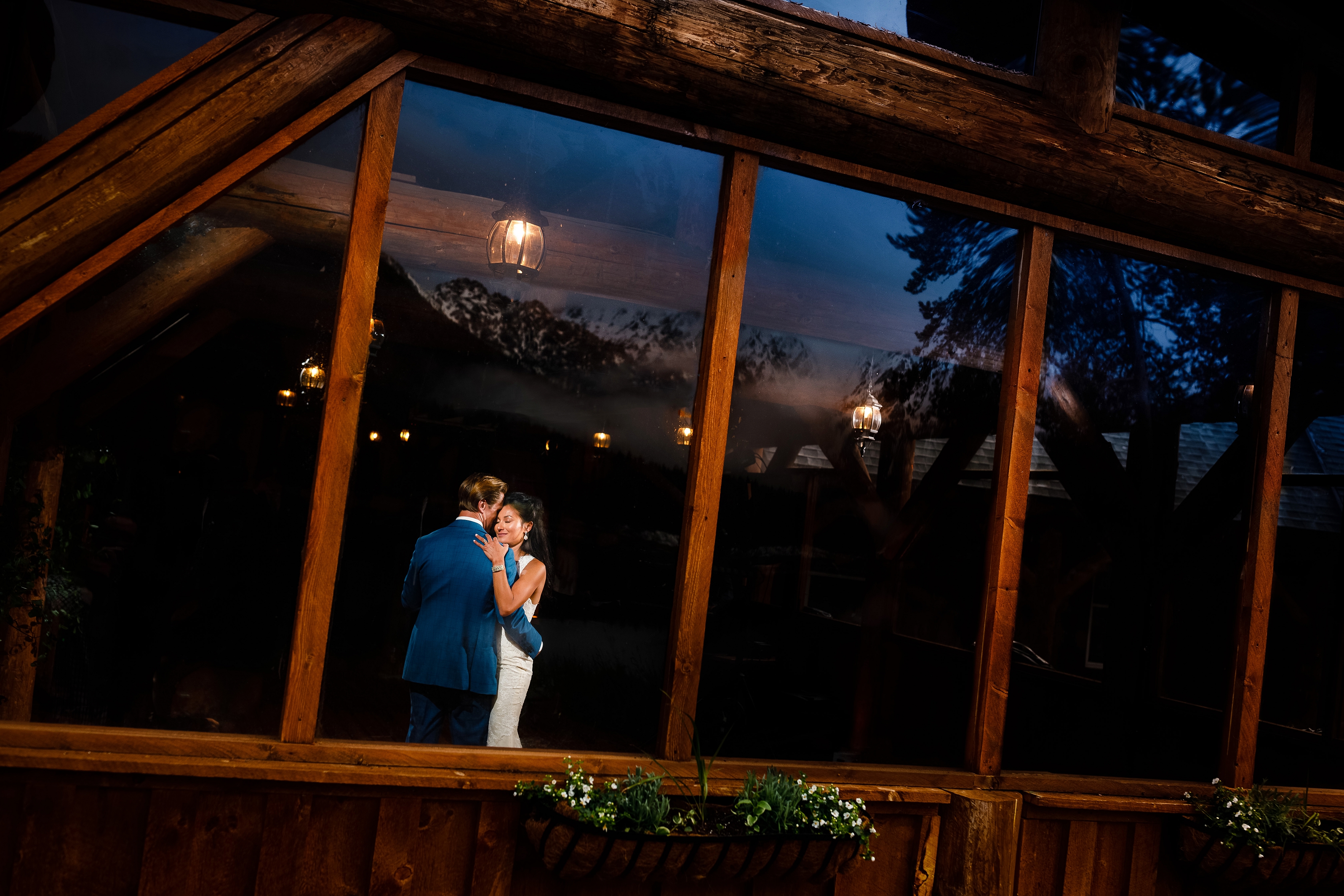 Their first dance inside the lodge at Piney River Ranch as the Gore Range catches its last bit of alpenglow.