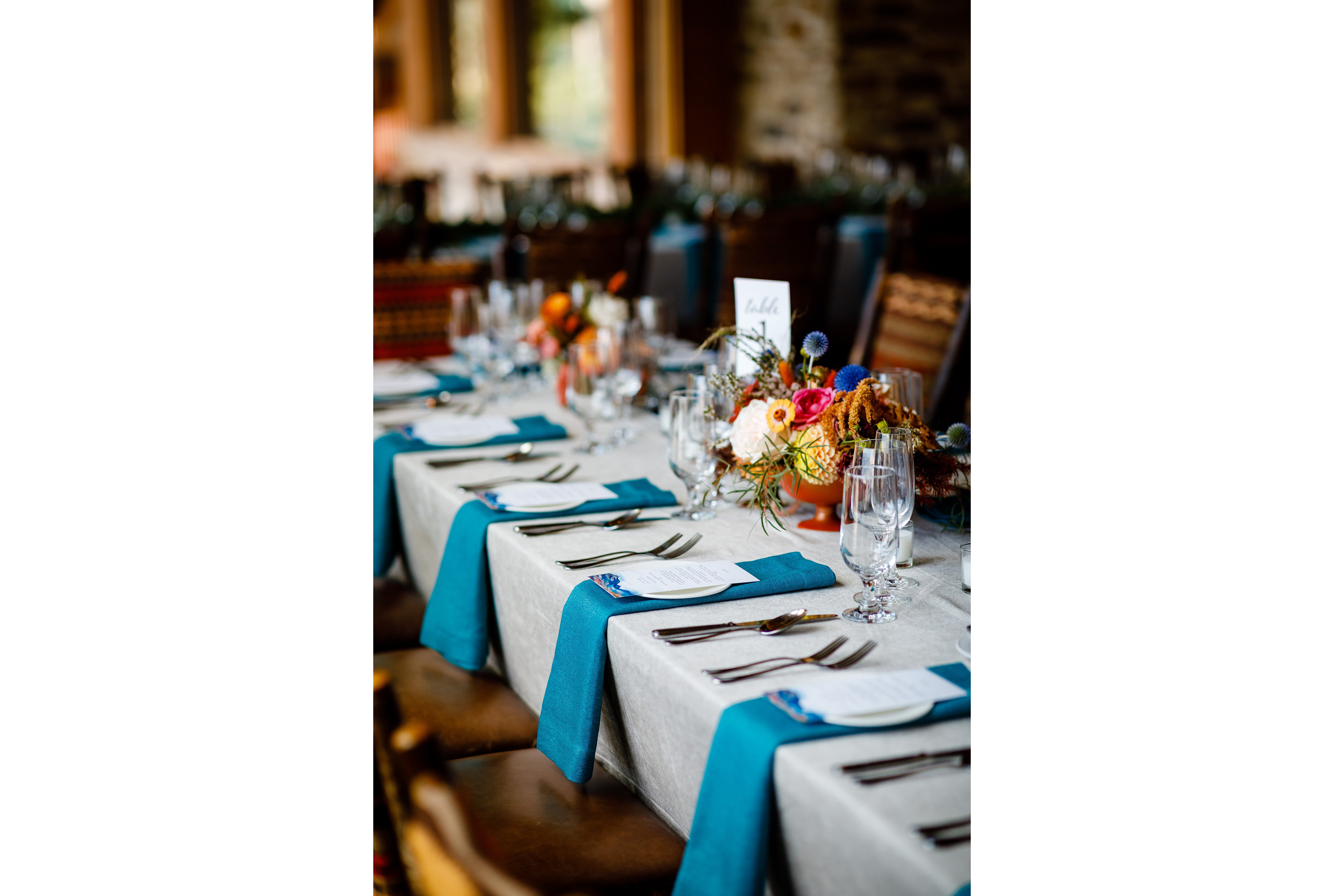 Reception décor, plates, flowers and menus for an Allred's wedding reception.