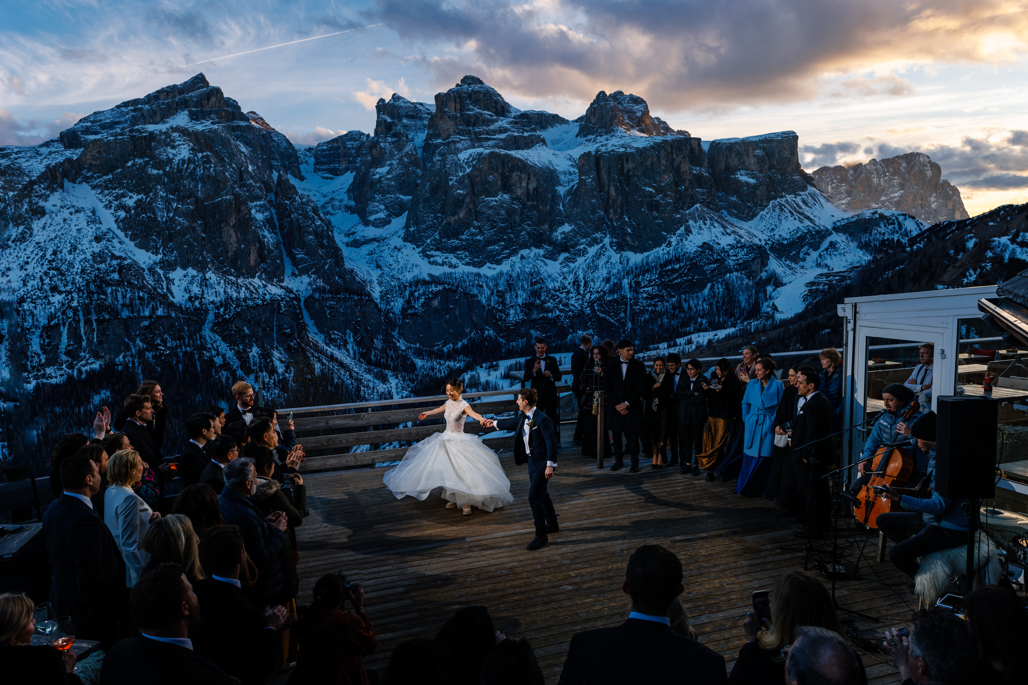 Alex & Iris finish their first dance on the deck for their wedding at Col Pradat in Colfosco, Italy.